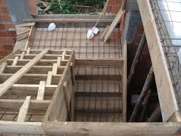 The circular wall that holds up the stairs is made from 5 foam blocks that leave a 3 vertical and horizontal void for concrete and rebar. How To Construct Concrete Stairs The Constructor