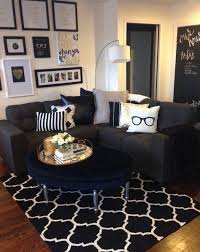 Bring in black hue by painting one of the living room's walls. Mini Living Room Re Do Classic Black White And Gold With Pops Of Navy Gallery Wall Apartment Decorating Rental Gold Living Room Small Apartment Living Room
