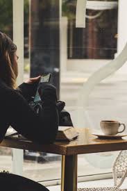 woman using smartphone inside coffee shop coffee shop coffee love coffee