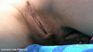 Natural hairy babe Trixie strips outside and plays with her pussy