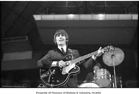 In honor of george harrison, the fender custom shop has recreated the famous rosewood telecaster prototype seen in let it be with painstakingly detailed precision. George Harrison Playing Guitar At The Beatles Concert Seattle Center Coliseum August 21 1964 Museum Of History And Industry University Of Washington Digital Collections