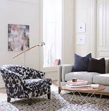 It can be either an accent chair that brings in new color along with the pattern that is inherent or can blend in with the color scheme of the room. Mixing Patterns 8 Tips To Make It Easy Schneiderman S The Blog Design And Decorating Patterned Chair Living Room Mixing Patterns Living Room Rugs In Living Room