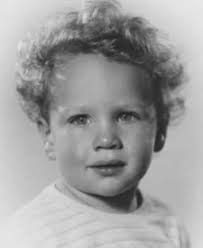 Recognize him? Take a good look. This young fellow was to grow up and  become a world famous movie star. He played a boxer in one biographical  film. He was a bank