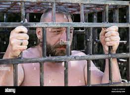 Man in a cage hi-res stock photography and images - Alamy