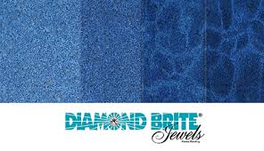 This polished pool finish combines ivory toned pebbles and a large amount of blue glass and a generous amount of ocean shells. Dark Blue Shade Sgm Inc