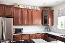 With blonde wood, your decorating possibilities are endless. Decorating Above Kitchen Cabinets Craving Some Creativity