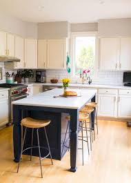 Amazing gallery of interior design and decorating ideas of white and gold kitchen island lights in kitchens by elite interior designers. White Kitchen Remodel Our White And Gray Kitchen On A Budget