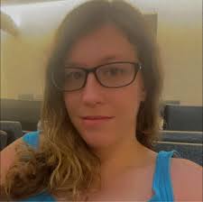 There is an Aussie running down Kathleen rd towards Campbell. Couldn't tell  if it was male or female. Mostly white with some grey!