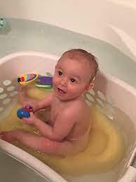 How often a baby gets a bath, what is in the baby wash and shampoo and whether the skin is properly moisturized after bathing are things that could help bring on eczema, recent studies suggest. Baby Bath Time In Laundry Basket Baby Is Too Big For Those Infant Baths But Not Really Old Enough To Be Left With Nothi Baby Bath Time Baby Bath Baby Bath