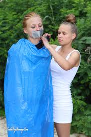 BoundHub - girl tied and gagged in trashbags on the beach