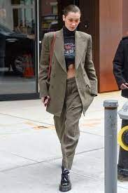Check spelling or type a new query. Bella Hadid Wearing Olive Double Breasted Blazer Black Print Cropped Sweater Olive Tapered Pants Black Leather Platform Loafers Bella Hadid Outfits Bella Hadid Street Style Street Style