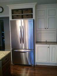 Space Above Fridge Idea I Like This Or Making It Into A Wine Rack Want To Change The Cabinets Kitchen Remodel Refrigerator Cabinet Farmhouse Kitchen Cabinets