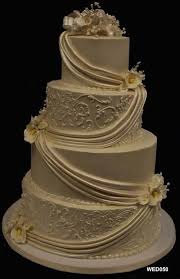 Wed050 4 Tier Ivory Round Wedding Cake With Flowers And Swags 50 78 4 Tier Wedding Cake Round Wedding Cakes Wedding Cake Bakery