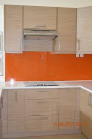 Melamine Woodgrain Royal Oak Finish With Graphicoat Orange Backsplash Nuestone White Granite Co Modular Kitchen Cabinets Kitchen Upgrades Granite Countertops