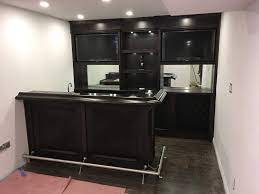 This Custom Home Bar Utilizes The Customer S Available Space In Their Basement To Create An Amazing Ente Custom Home Bars Workout Room Home Bar Interior Design