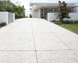 We are definitely having an exposed concrete paver around the boarder of the pool, the header course. Concrete Tiles Concrete Patio Designs Concrete Patio Exposed Aggregate Driveway