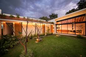 Deep luxurious browns are seen in flooring and statement furniture pieces. Tropical House With A Lush Courtyard Designs Ideas On Dornob