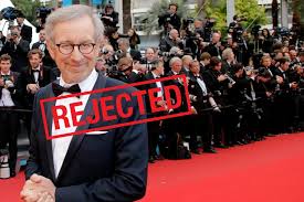 He is well known for founding the company amblin entertainment which includes jaws, the indiana jones franchise, e.t. Steven Spielberg On Red Carpet With Word Rejected Stamped On Image C Ap Images Young Leaders Of The Americas Initiative
