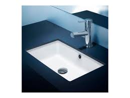 An undermount installation allows this sink to seamlessly integrate into your bath or powder room. Caroma Cube Undercounter Basin With Overflow 500mm White From Reece