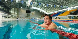 Swimmer eric moussambani comes up for air as he swims the front crawl at the sydney olympics in 2000. Sydney Olympics Legacy Lives On