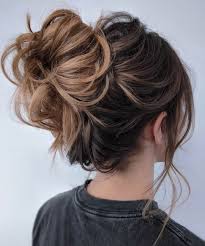 Just part your hair at your temples to section it off (keep in mind that parting your hair from ear to ear will leave you with an even larger bun), then twist the hair around itself to form a messy bun. 50 New Updo Hairstyles For Your Trendy Looks In 2021 Hair Adviser
