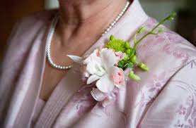 As with bridal fashion, mother of the bride attire doesn't have many steadfast rules. Who Gets Wedding Corsages And Wedding Boutonnieres Corsage Wedding Mother Of Bride Corsage Mother Of The Bride Flowers