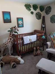 Safari nursery decor featuring smiling giraffes and playful monkeys completes this whimsical look. Gender Neutral Disney Jungle Themed Nursery Jungle Theme Nursery Baby Room Themes Nursery Themes