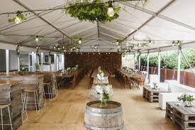 Rustic Backyard Marquee Wedding Wine Barrels Pallet Furniture Ottomans Wedding Marquee Rustic Wedding Table Decorations Vintage Wedding Cocktail Table Decor