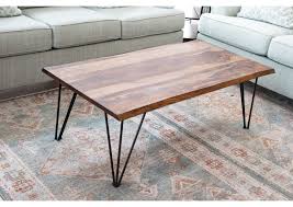 A lot of people will tell you that a coffee table is a necessary piece of furniture for a living room. Taj Live Edge Coffee Table