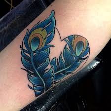 Here the semantic meaning of the design, which extends from the shoulder to the shoulder blade, is a creative, extraordinary personality. 35 Colorful Peacock Feather Tattoo Meaning Designs 2019