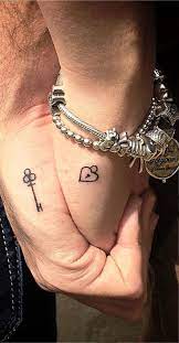 Here is another take on the amazing skull tattoo designs for couples. 55 Lovely Couple Tattoo Ideas To Show Their Love To The World Instaloverz Matching Couple Tattoos Best Couple Tattoos Couple Tattoos Love