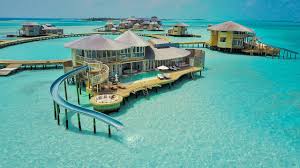 Over the lagoon living combined with spectacular sunset views. Over Water Villa In The Maldives With A Private Pool And A Water Slide Into The Indian Ocean Mansion Global