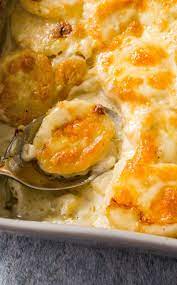 Cheddar Scalloped Potatoes Heavy Cream Lots Of Cheddar Cheese And The Starch From The Sp Scalloped Potatoes Cheddar Scalloped Potatoes Vegetable Side Dishes