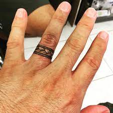 Pin By Ivie Furlan On Wedding Ring Tattoos Ring Tattoo Designs Wedding Band Tattoo Wedding Finger Tattoos