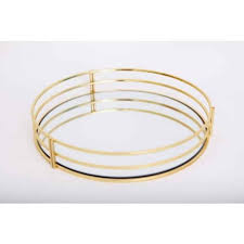 A round and durable construction completes the contemporary design of this mirror tray. Gold Round Mirrored Tray Dia 30cm