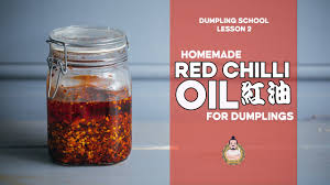 Pour in the warm water, stirring with a wooden spoon. Dumpling School 2 Red Chilli Oil For Dumplings çº¢æ²¹ Youtube