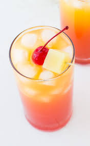 Keep your party guests content with this creamy, fruity drink with malibu, coconut milk, pineapple and mango. Easy Pineapple Rum Punch Deliciously Sprinkled