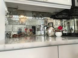 This would help add light and the illusion of more space to a small. Antique Mirror Backsplash Installed