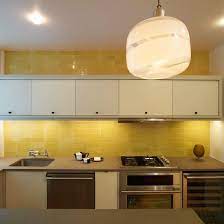 Floor color, countertops and cabinetry are three major components of the color scheme in your kitchen. Yellow Kitchen Modern Kitchen Design Idea Ideal Home Yellow Kitchen Tiles Small Kitchen Tiles Modern Kitchen Backsplash