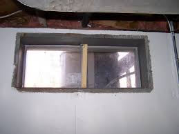 If your floor is horribly out of level, or if you're framing around a window, it may be best to stick frame— nailing one stud at a time instead of building the wall on the floor. Basement Waterproofing Basements With Windows In Connecticut Old Basement Window In Windsor Locks Ct
