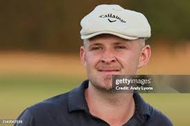 Matthew NeSmith of the United States plays his shot from the 18th tee...  News Photo