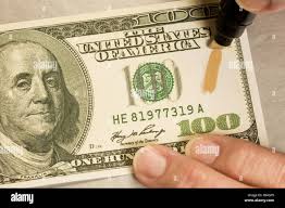 Counterfeit money pen hi-res stock photography and images