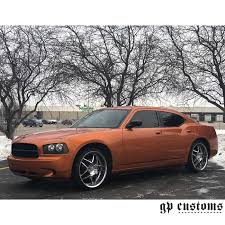 This is a great alternative to painting because it is durable. Dodge Charger Wrapped In Gloss Liquid Copper Vinyl