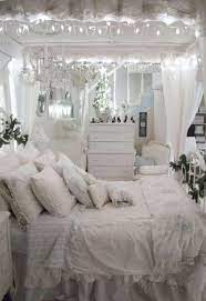 A gorgeous shabby chic bedroom in white, with a wooden bed and an artwork, a mint screen, a fan, neutral bedding with ruffles. This Blue And White Bedroom Is So Romantically Beautiful Shabby Chic Project Ideas Shabby Shabby Chic Romantic Bedroom Shabby Chic Bedrooms Modern Shabby Chic