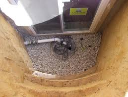 Tile is a misnomer since it's not actually tile but pipe. Basement Waterproofing Drainage Egress Window Installed In Basement Bedroom