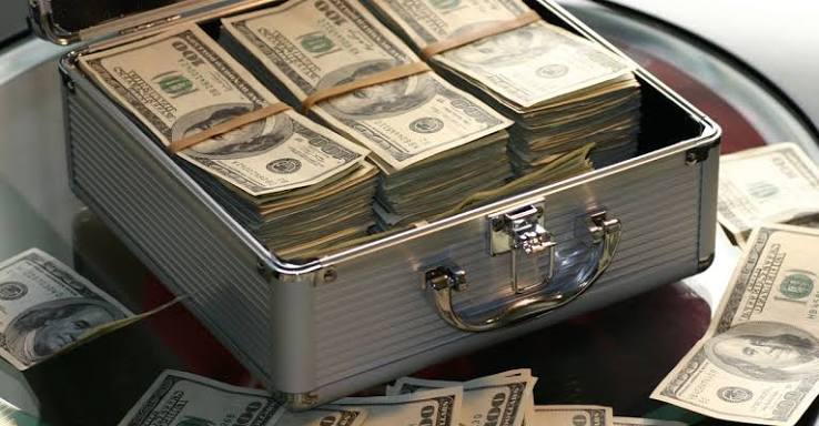 Hard Cash on a Briefcase · Free Stock Photo
