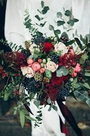 Our bride's jewel toned bridal bouquet by los angeles florist winston and main features peonies, roses, ranunculus, anemone, dahlia, and guava greenery. Stunning Winter Wedding Bouquet In A Dark Jewel Tone Color Palette Winter Wedding Bouquet Winter Wedding Flowers Wedding Flowers