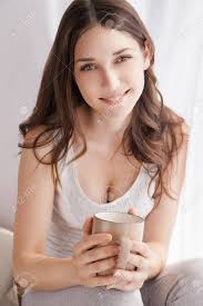 Download woman drink coffee images and photos. Beautiful Woman Drinking Coffee In The Morning Sitting By The Stock Photo Picture And Royalty Free Image Image 36738230