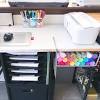 It has storage on both ends as well as a plexiglass top. 3