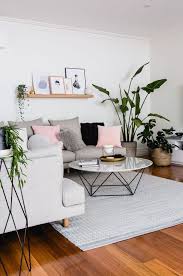 Vibrant pink living room designed with gallery frames and interlaced mirrors. How To Decorate A Grey And Blush Pink Living Room Decoholic